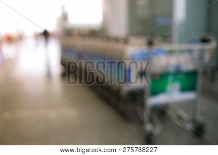 Blurred Defocused Image Of Airport Luggage Cart, Trolleys Luggage In Airport Or Market, Mall, Superm