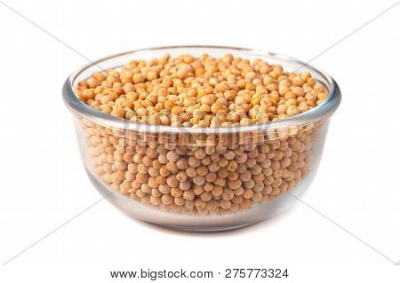 Seeds Of Peas On Glass Bowl On White Background