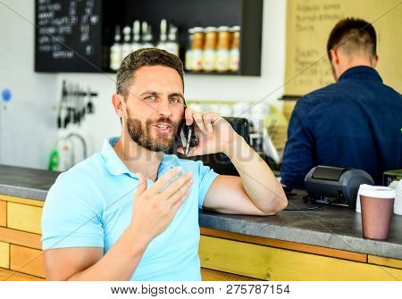 Lets Meet In Cafe. Man Mobile Conversation Cafe Barista Background. Drink Coffee While Waiting. Coff
