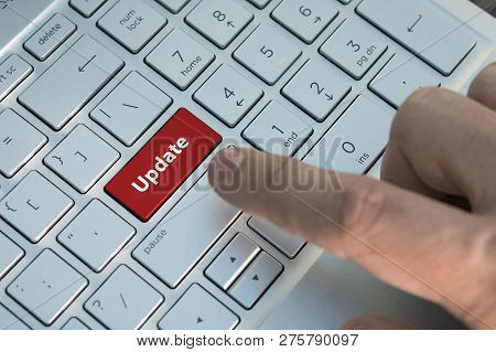 Customized Concept With Computer Enter Button On Keyboard: Update. A Male Finger Presses A Color But