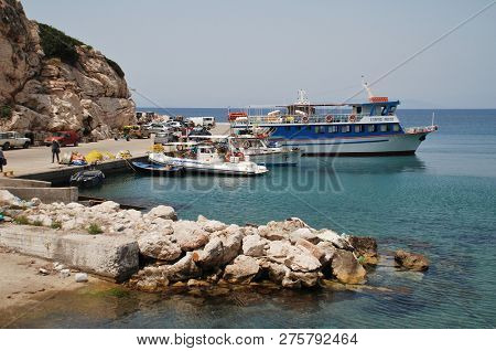 RHODES, GREECE - JUNE 7, 2017: Boats moored at Kamiros Skala harbour on the Greek island of Rhodes. The port is a departure point for ferries to the islands of Halki and Tilos.