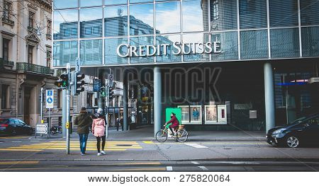 Bale, Switzerland - December 25, 2017: People Walk In Front Of An Agency Of Credit Suisse Business B