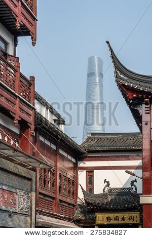 Shanghai - China - 26 October 2018: Contrast Between Old Shops Off Fuyou Rd In Old Town With Modern 