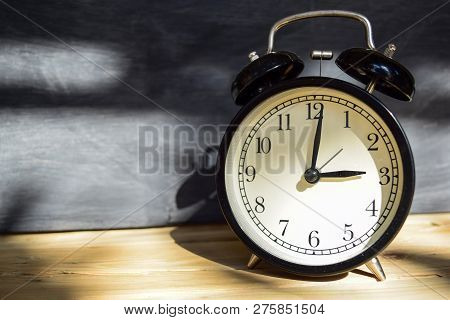3 Am/pm Back To School Concept. Alarm Clock On Wooden With Blackboard On Background