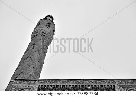 Minaret Of Saint Petersburg Mosque On Petrograd Side At Cloud Day, Russia. Black And White.