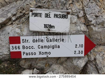 Arrow Trail Marker In Mountains With Italian Text And More Place  In Pasubio Mountain  In Italy