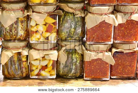 Many Jars Of Red Sauce Of Spicy Peppers Garlic And Marinated Anchovies Prepared By Hand In A Mediter