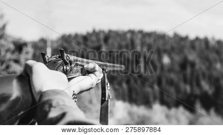 Hunter With Retro Shotgun Aims At The Target. Hunting Season