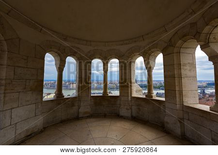 View of Danube river through one of 7 towers of Fisherman's Bastion on the Castle hill, Budapest, Hungary