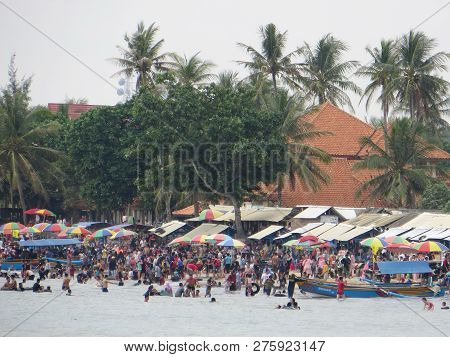 Anyer, Indonesia - June 24, 2018: Crowd Of People Doing Activities At Sambolo Beach. Month Of June I