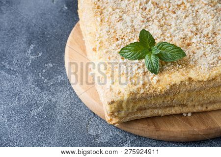 Layered Cake With Cream Napoleon Millefeuille Vanilla Slice With Mint On Dark Background.