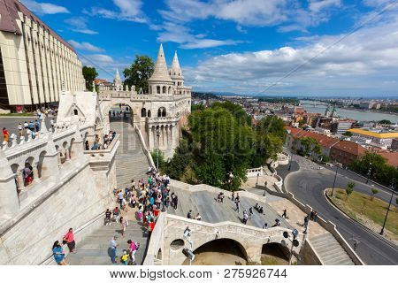 BUDAPEST, HUNGARY - JULY 2018 : People walking at Fisherman's Bastion on Buda bank of the Danube river, on Castle hill, Budapest, Hungary on July 19, 2018