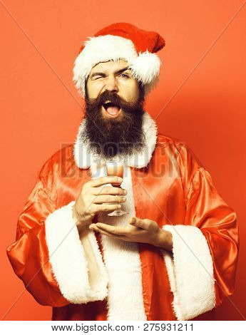 Handsome Bearded Santa Claus Man With Long Beard On Smilingface Holding Glass Of Alcoholic Shot On H