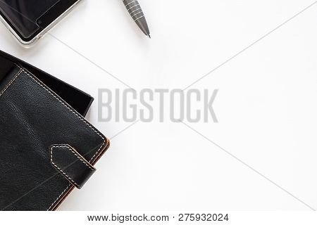 Leather Closed Two Notebooks With Clips With Orange Stitch On Edges Half Seen Put Diagonally And Edg