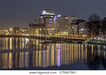 Riga, Latvia - April 29, 2018: Evening Cityscape At Bank Of Daugava River. Urban View Of National Li