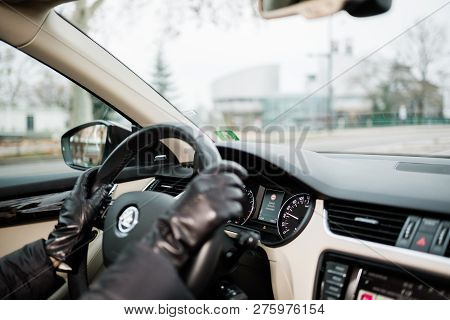 Strasbourg, France - Dec 26, 2018: Woman Driving Skoda Octavia Czech Car Wearing Leather Gloves With