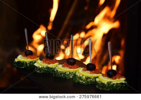 Delicious Canapes With Red Caviar Appetizers. Appetizers In Portions Of Cream Cheese And Natural Sal