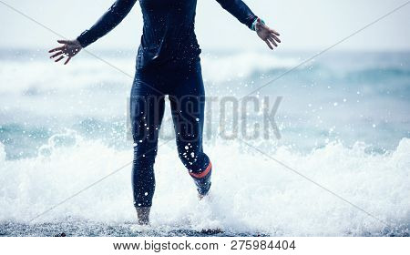 Woman Is Running And Jumping In Seawaves