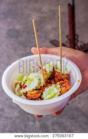 Tod Mun Kala In Foam Cup, Thai Cuisine Served With Cucumber And Sweet Sour Sauce With Crispy Crunchy