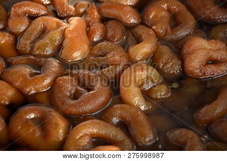 Close Up Of Brown Color Paneer Jabeli Also Known As Chanar Jalebi In Bengali Soaked In Sugar Syrup, 