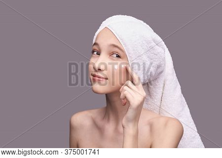 Young Girl Apply Anti Age Cream. Skin Care Home Routine. Sun Protect Cosmetic Product. Copyspace. Cl