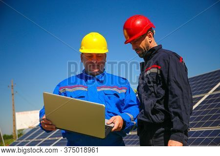 Two Tehnicians With Laptop In The Power Plant