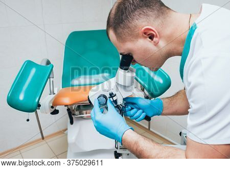 Gynecologist Working With Colposcope In Clinic. Medical