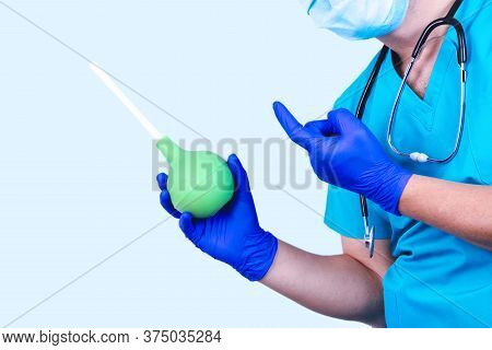 Enema In The Doctor Hand. Colon Lavage Medical Concept, Prevention.
