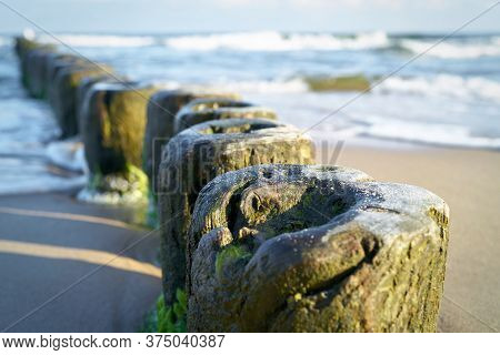 Breakwater On The Beach Of The Baltic Sea Near Rewal In Poland