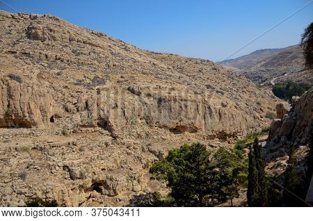 Wadi Kelt Or Nahal Prat, In The Judean Desert, Israel. View Of The Cliffs And Gorge, Blue Sky.
