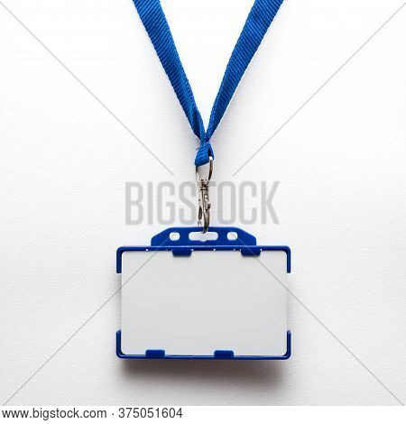 Blank Name Tag Or Identification Badge On Blue Strap. White Background