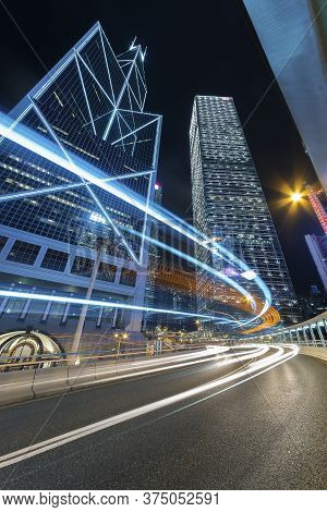 Traffic In Dowmtown District Of Hong Kong City At Night