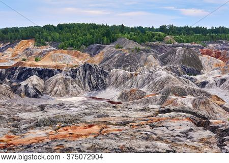 Multi-colored Eroded Hills And Destroyed Soil Layer At The Open Cast Mining Site Of Kaolin