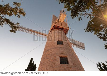 Jerusalem, Israel, June 26, 2020 : The Famous Montefiore Windmill Built In 1857, Now With Neighborho
