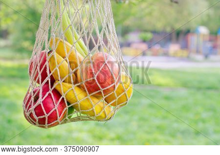 Trendy String Bag With Fruits. Shopping Bag. Trendy Closeup For Lifestyle Design. Fresh Fruit. Cloth