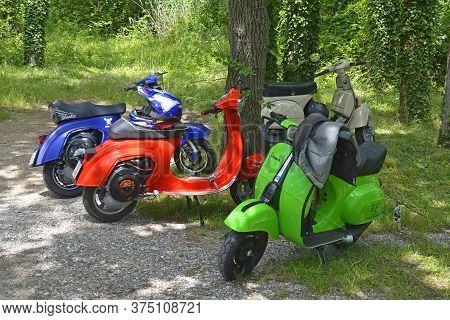 Villaggio Di Punta Sdobba, Italy - June 14 2020. Four Vespas, Part Of A Small Rally Of Vespa Motorik