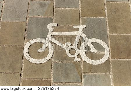 A Close Up View Of A Bicycle Only Sign That Has Been Painted On The Pavement