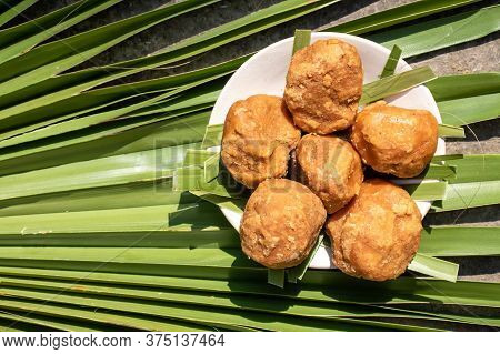 Top View Of Sweet Palm Jaggery In A Plate Isolated On A Palm Leaf