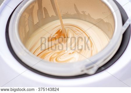 Electric Wax Warmer Or Wax Heater With Melted Wax During Heating Inside Bowl