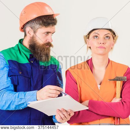 Insubordination Concept. Man And Woman In Helmets