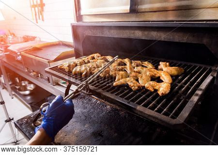 Fried Chiken Wings At Grill Barbecue. Restaurant.