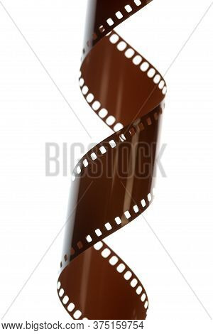 Vertical Coil Of Photographic Film Against A White Light Box