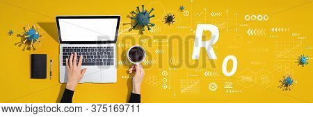 R Nought Theme With Person Using A Laptop Computer