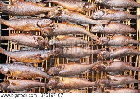 Smoked Fish. Smoke. Hot Smoked Fish Meat. Smoked Fish. Perch. Smoked Fish Background Texture.