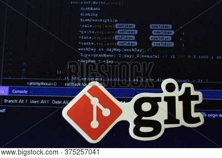Moscow, Russia - 1 June 2020: Git Logo Sign With Program Code On Background Illustrative Editorial.