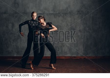 Young Couple Dancing In Ballroom Dance Paso Doble
