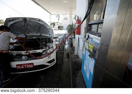 Salvador, Bahia / Brazil - November 22, 2018: Vehicle During Filling With Vehicular Natural Gas - Cn
