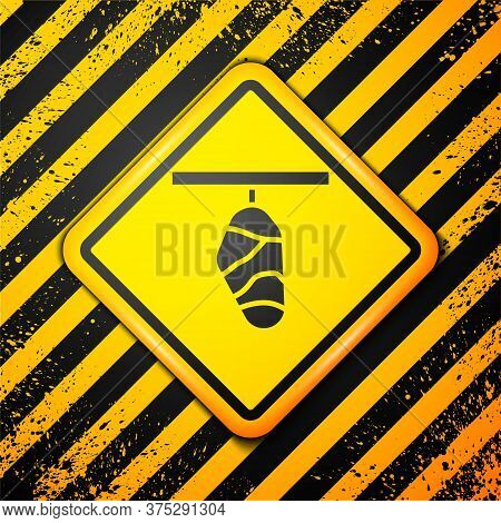 Black Butterfly Cocoon Icon Isolated On Yellow Background. Pupa Of The Butterfly. Warning Sign. Vect