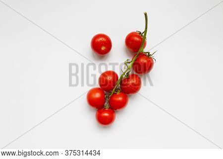 Fresh Raw Tomatoes, Insulated On A White Background, View From Above