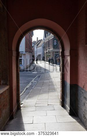 A Quaint Archway At Kingsgate Leading On To A Side Street Near The Cathedral In Winchester In The Uk